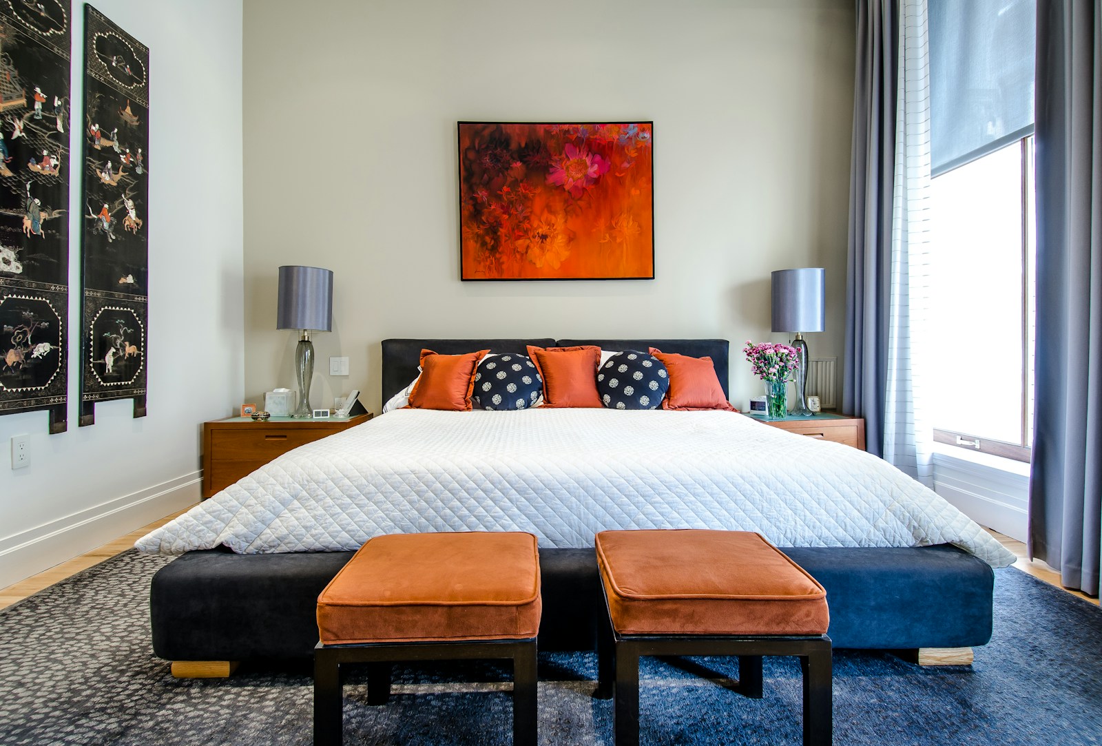 Warm, comfortable furnished bedroom with curtains drawn